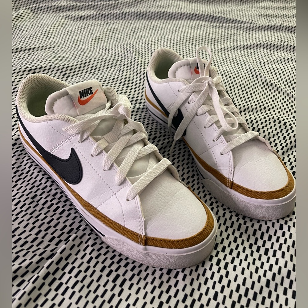 Nike Women’s White Sneakers with Black Swoosh and Brown Accent